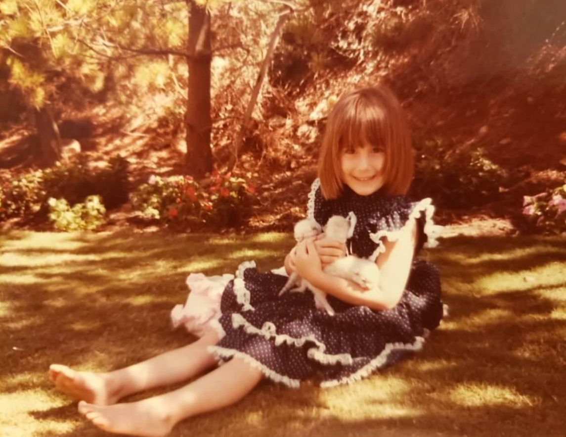 girl holding kittens